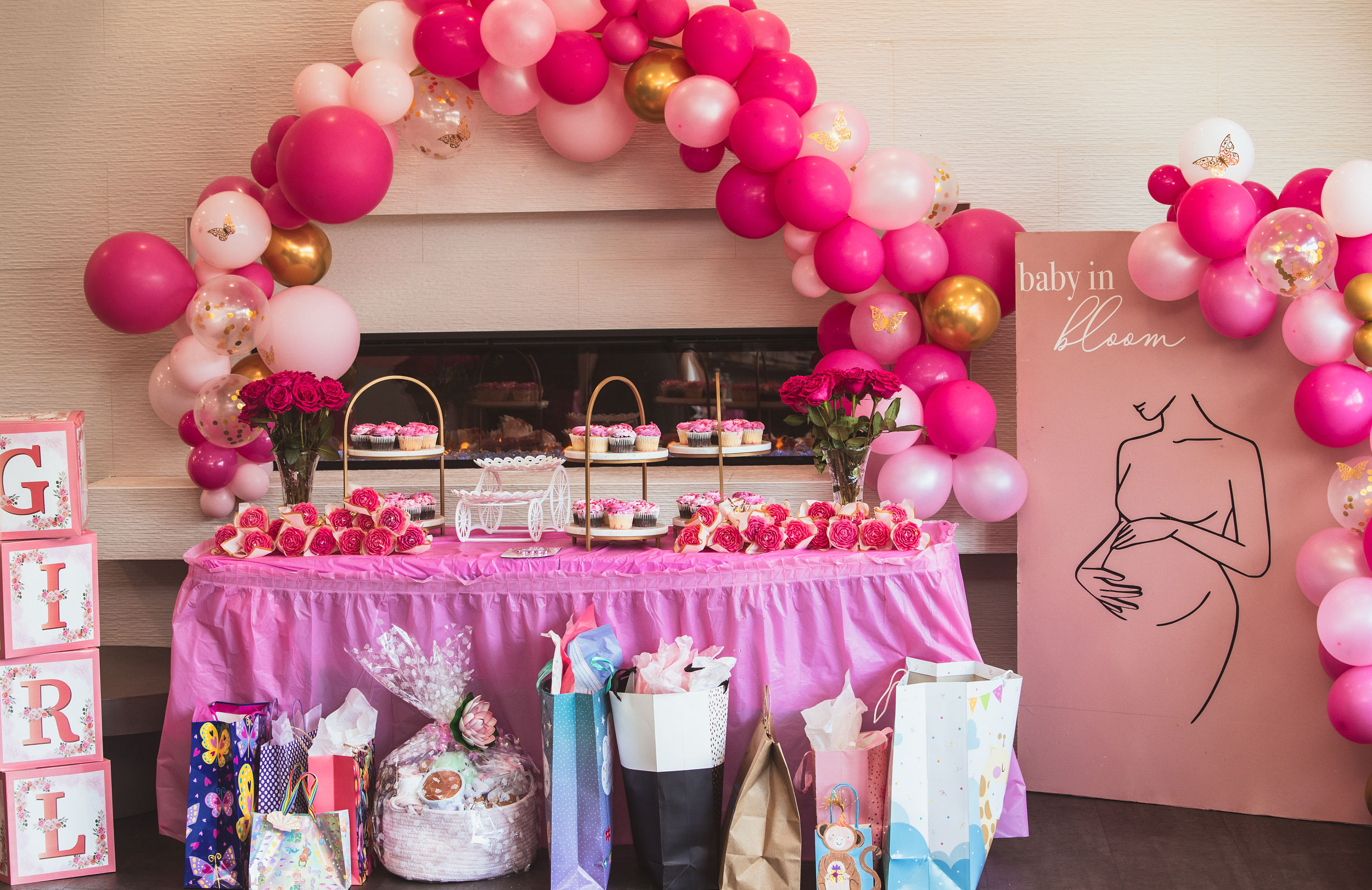 Baby in Bloom dessert table with pink balloon arch