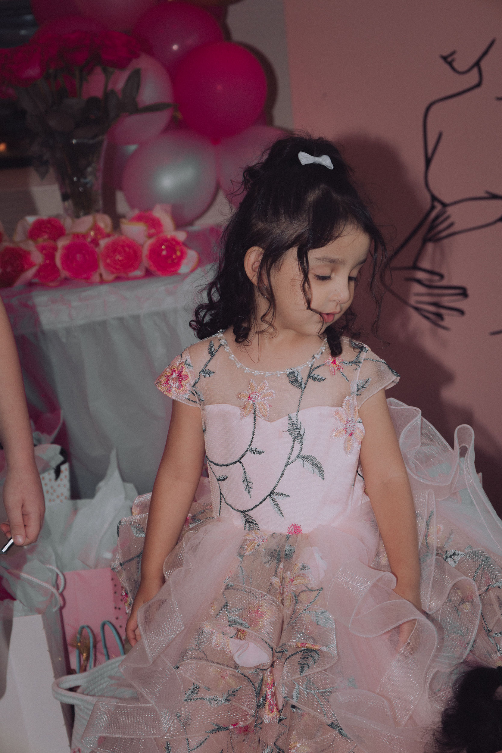 Little girl in a pink floral dress